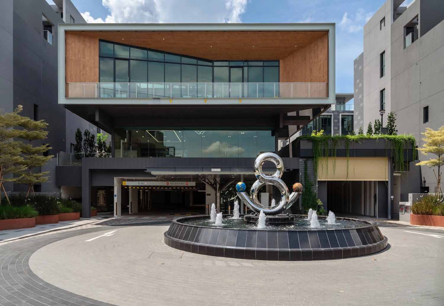 Clubhouse and sculptural fountain at Belgravia Ace