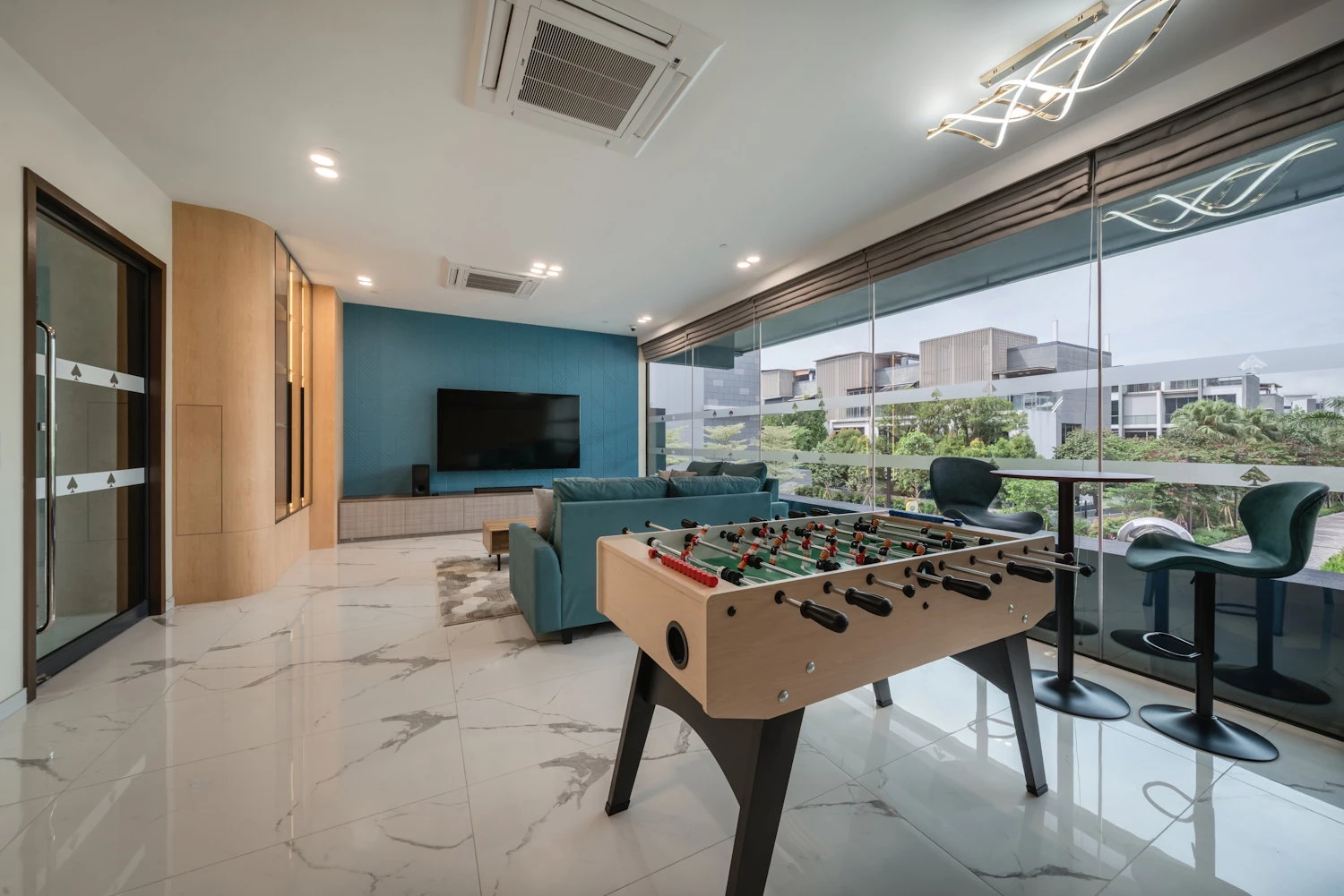 Entertainment room with table football and seating